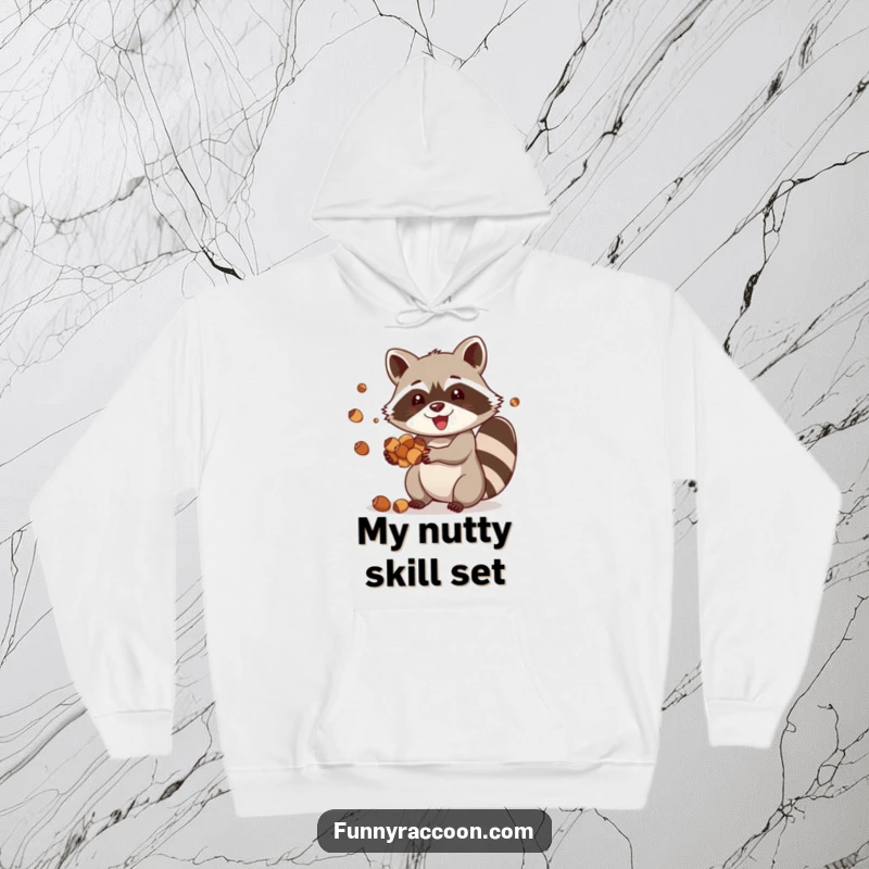 Funny raccoon hoodie, a happy raccoon joyfully juggling acorns, offering warmth and a touch of playful skill.