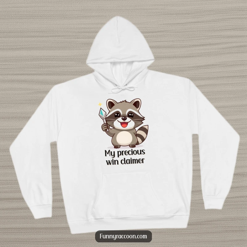 Funny raccoon hoodie, a happy raccoon holding a shiny object with a triumphant smile, offering warmth and celebratory style.