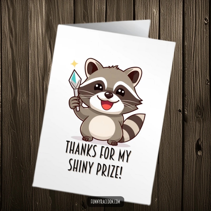 Funny Free Printable Raccoon Thank You Card: A smiling raccoon triumphantly holds a shiny object, offering a funny and grateful thank you.