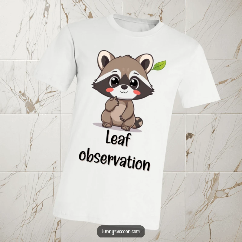 Funny Raccoon T-Shirt: A raccoon's eyes are wide with amazement as it points at a levitating leaf, showcasing pure fascination.