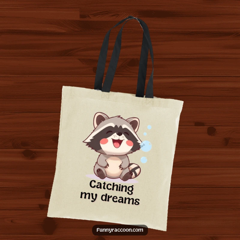 Funny raccoon with a big, playful grin is depicted on a tote bag, attempting to catch floating, iridescent bubbles.